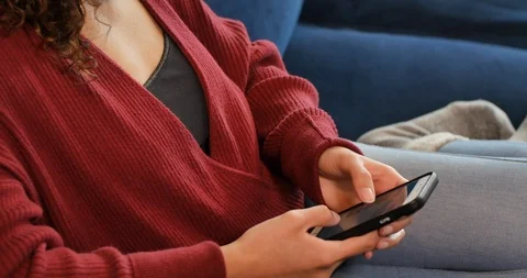 Young Millennial Scrolling through Amazon.com for Gifts and Retail Shopping 스톡 동영상 126404014