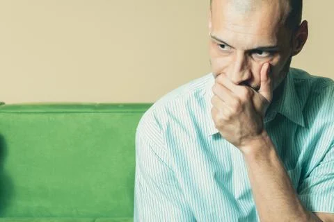Young miserable man feeling depressed while he thinking about future life Stock Photos