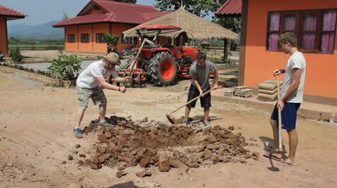 Young Missionaries Working On Project Overseas Stock Footage