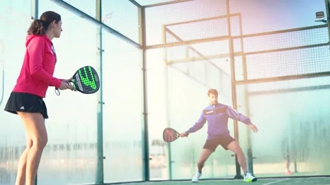 Young mixed match playing padel tennis Video stock 263615972