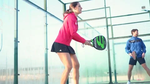 Young mixed match playing padel tennis Stock Footage 263616096