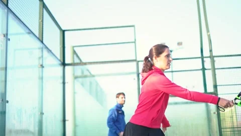 Young mixed match playing padel tennis Stock Footage 263616132