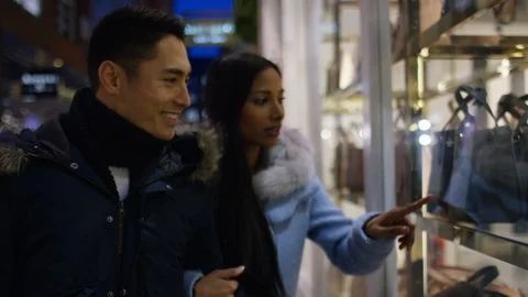 Young mixed race couple window shopping together Video stock 100254845