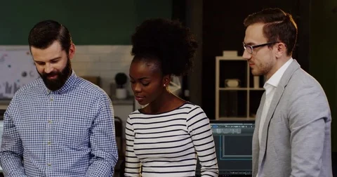 Young mixed races group of startuppers discussing a new project and are cheerful Stock Footage 82446742