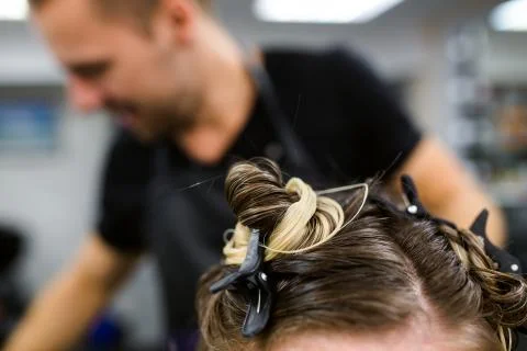 Young model with colored topknot and hidden undercut bleached hair Foto stock