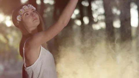 Young model dancing with smoke bombs in forest Stock Footage 264012434