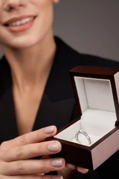 Young model demonstrating expensive ring. Stock Photos