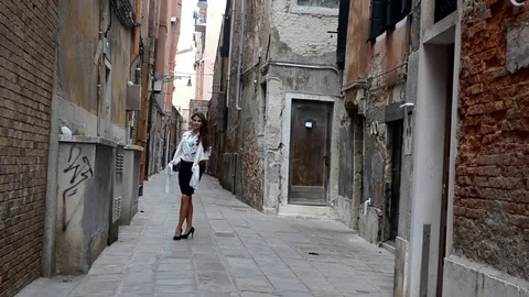 Young model dresses up the streets of Venice Italy Stock Footage 75923514