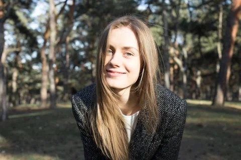 Young model looking at camera and smiling Stock Photos