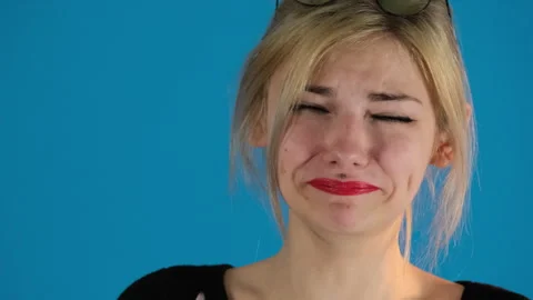 Young model with makeup changes smile on face to aggression 스톡 동영상 306487361