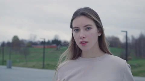 The young model in the park. The close up shot.Red Helium 8K Stock Footage 142698180