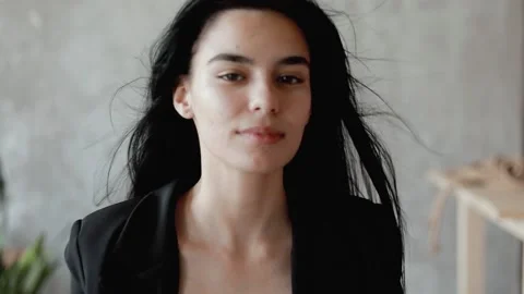 A young model poses for the camera. portrait of an oriental girl. Stock Footage 205086677