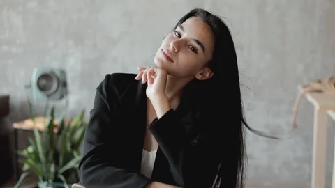 A young model poses for the camera. portrait of an oriental girl. Stock Footage 205086737