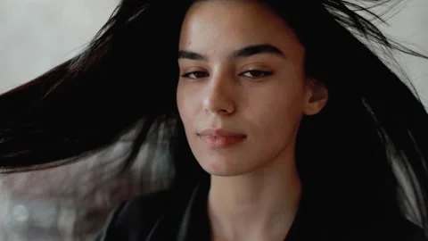 A young model poses for the camera. portrait of an oriental girl. Stock Footage 205086738