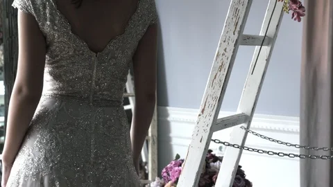 Young model poses in white lacy wedding dress with beads Stock Footage 108103639