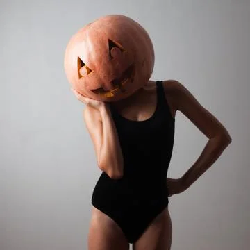 Young model with pumpkin head Foto stock
