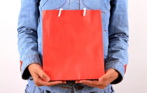 Young model with shopping bag in hands Stock Photos