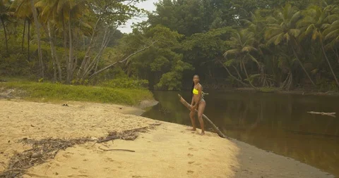 A young model twerking and riding a log ... | Stock Video