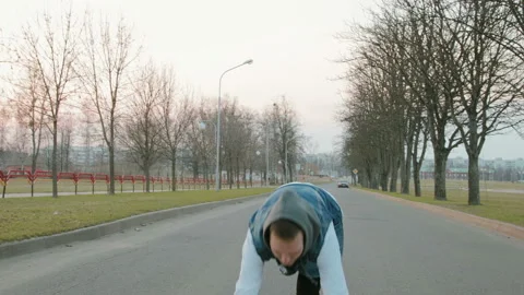 Young modern guy in a white jacket and a blue denim vest with a hood, performing Vidéo 108721505