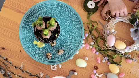 Young mom with daughter is setting easter festive table with bunny and eggs Stock-Footage 171862716