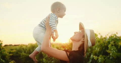 Young Mom have fun time with her cute little child in French Provence vineyard 動画素材 203839435