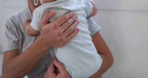 Young mom having fun with her son in bed at home Video stock 168816319