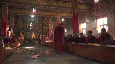 A young monk hands out pamphlets in a monastery in Kathmandu Видео 48784331