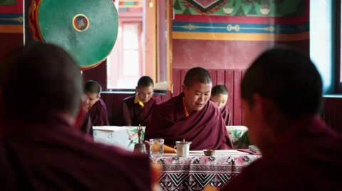 A young monk reading the buddhist script during a ritual. Stock Footage 31638905