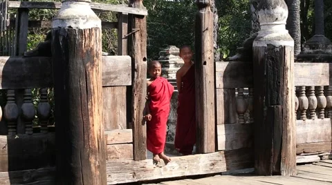 Young monk standing and looking at monastery in Mandalay. Myanmar, Burma Stock Footage 62307753