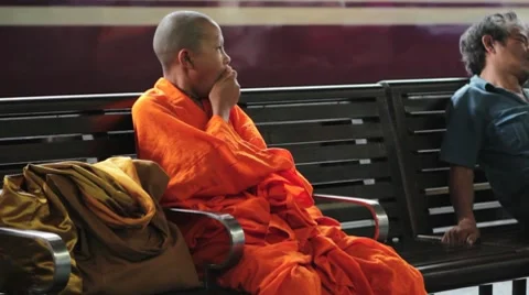 Young Monk Waiting for Train Stock Footage 8666063