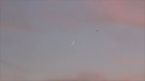 Young moonset on twilight Stock Footage 36742625
