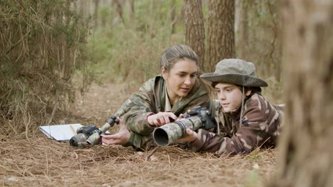 Young mother and son exploring wildlife in natural park Stock Footage 179436367