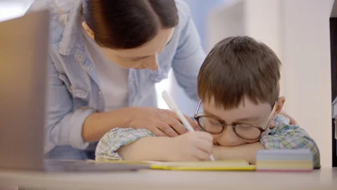 Young mother arguing with child, doing homework at table, learning difficulties Stock Footage 149243606
