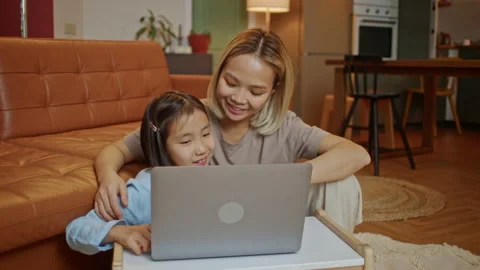Young Mother with Child Working on the Computer. Family at Home. Remote Work. Видео 205552446
