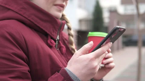 A young mother is drinking tea and texting on social networks. Stock Footage 144377919