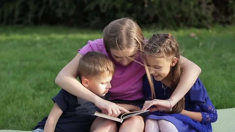 A young mother engaging in the upbringing of her children Stock Footage 80338997