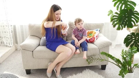 Young mother feeding her small son slow motion Stock Footage 74635207
