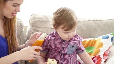 Young mother feeding her small son closeup Stock Footage 74635499