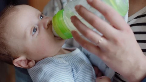 young mother feeding unhappy baby Stock Video Pond5