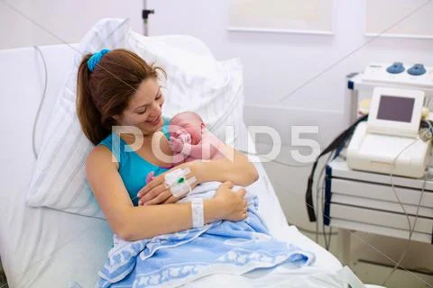 Young Mother Giving Birth To A Baby