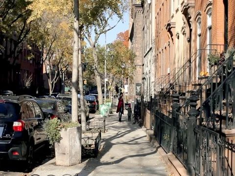 Young mother having fun with her kid son in autumn street New York Stock Footage 74006854
