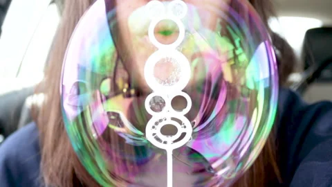 Young mother is having fun with soap bubbles. Stock Footage 186594278