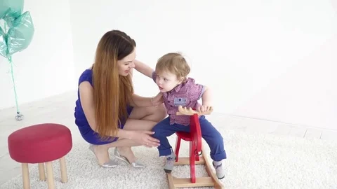 Young mother playing with her small son Stock Footage 74631396