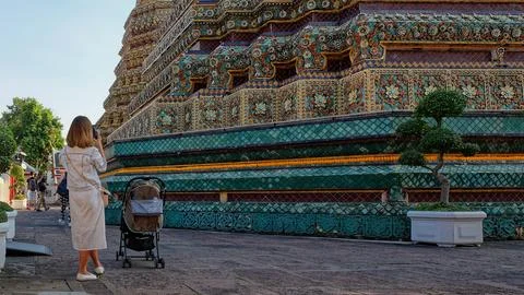 A young mother with a stroller Stock Photos
