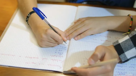 Young Mother teach son how to do homework at home,school child family education Video stock 220461704