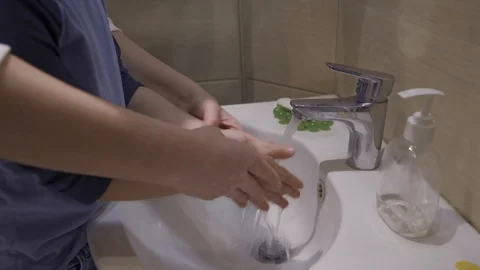 Young mother teaching son self hygiene by washing hands. Stock Footage 130044547