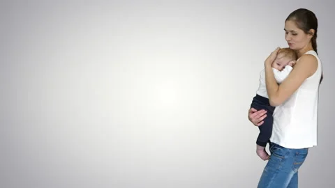 Young mother trying to calm down infant son, Alpha Channel Stock-Footage 130700582