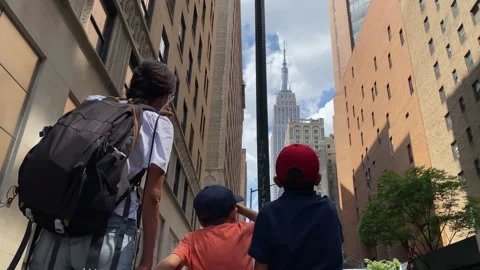 Young mother with two children visiting new york manhattan Stock Footage 228291930