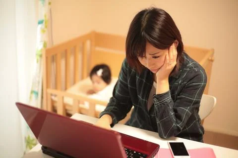 Young mother using a computer Stock Photos