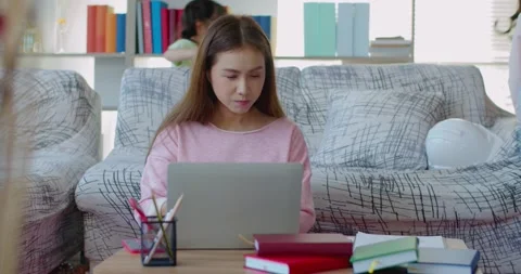 Young mother while working at home with two daughters naughty Stock Footage 138337047